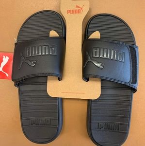 Black on black puma slides